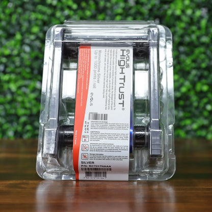 Angled view of the Evolis RCT217NAAA metallic silver monochrome ribbon in sealed blister pack, clearly showing the product label, red capacity strip, and barcode. Photographed and sold by Specialist ID, an authorized Evolis dealer.