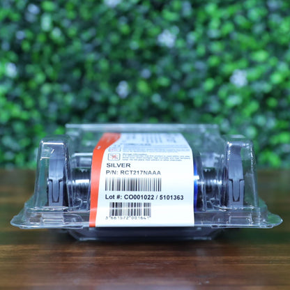 Close-up view of the Evolis RCT217NAAA metallic silver monochrome ribbon showing product label, part number, and lot barcode inside sealed packaging. Photographed and sold by Specialist ID, an authorized Evolis dealer.