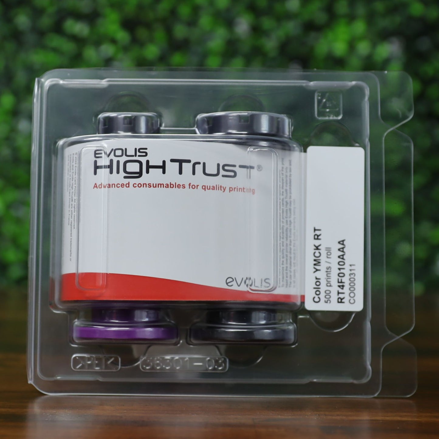 Evolis RT4F010AAA YMCK color ribbon shown inside original High Trust clamshell packaging, labeled for 500 prints per roll—used for retransfer ID card printers. Photographed and sold by Specialist ID, an authorized Evolis dealer.