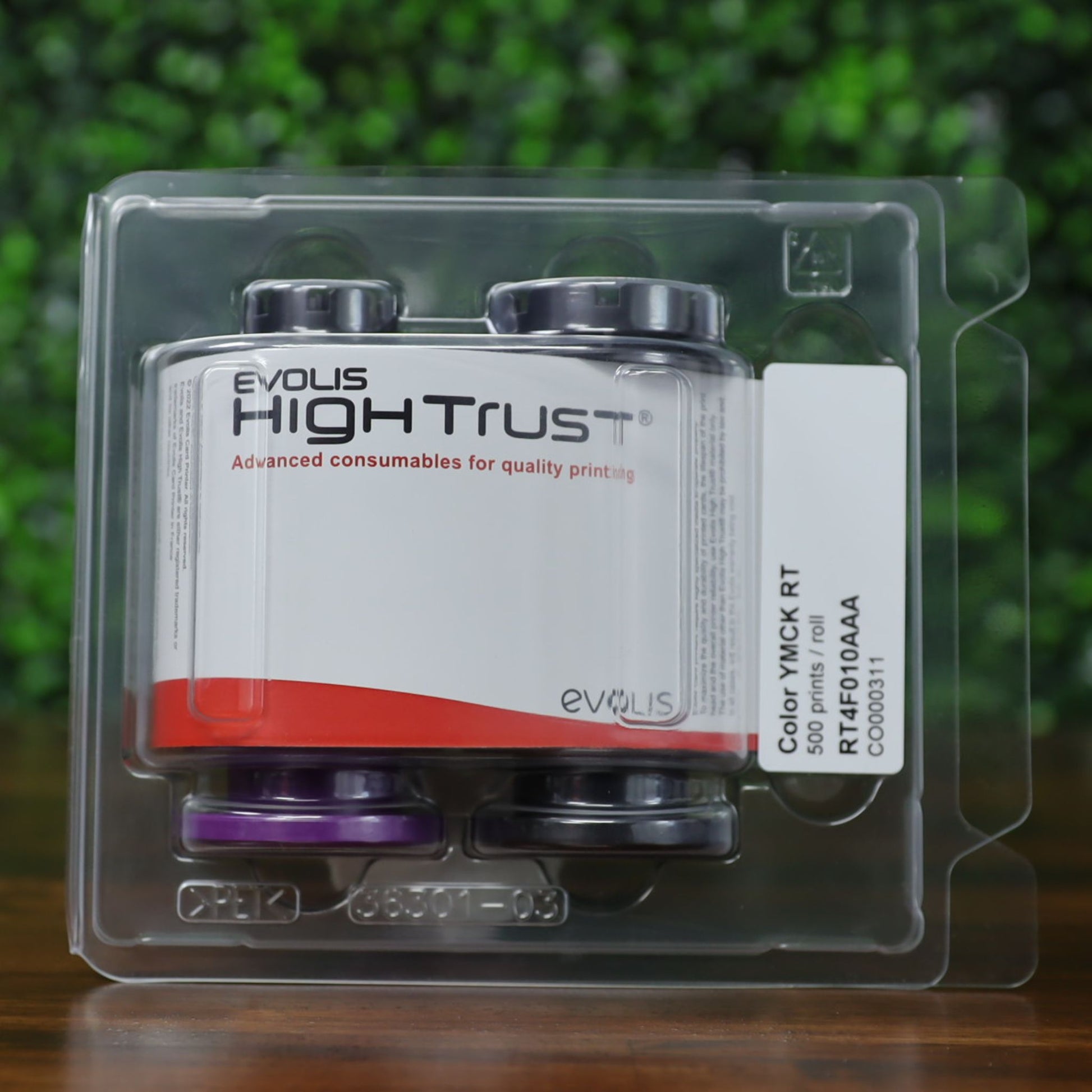 Evolis RT4F010AAA YMCK color ribbon shown inside original High Trust clamshell packaging, labeled for 500 prints per roll—used for retransfer ID card printers. Photographed and sold by Specialist ID, an authorized Evolis dealer.
