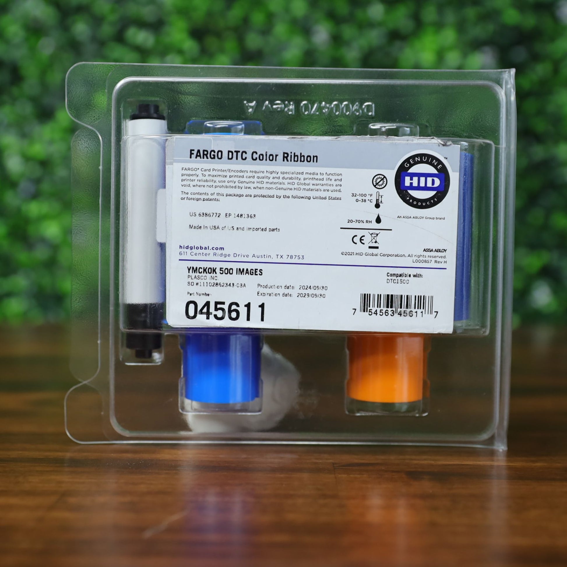 Front label view of the Fargo 45611 YMCKOK color ribbon, still sealed in clamshell packaging, showing barcode, yield count (500 images), and HID Genuine branding. Photographed and sold by Specialist ID, an authorized Fargo dealer.