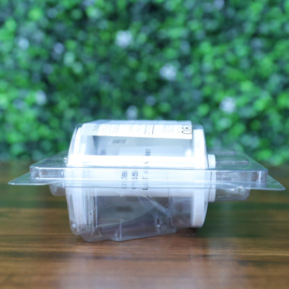 Side angle of the Fargo 82601 PolyGuard laminate ribbon in sealed clamshell packaging, showcasing white hub and product label curvature. Photographed and sold by Specialist ID, an authorized Fargo dealer.