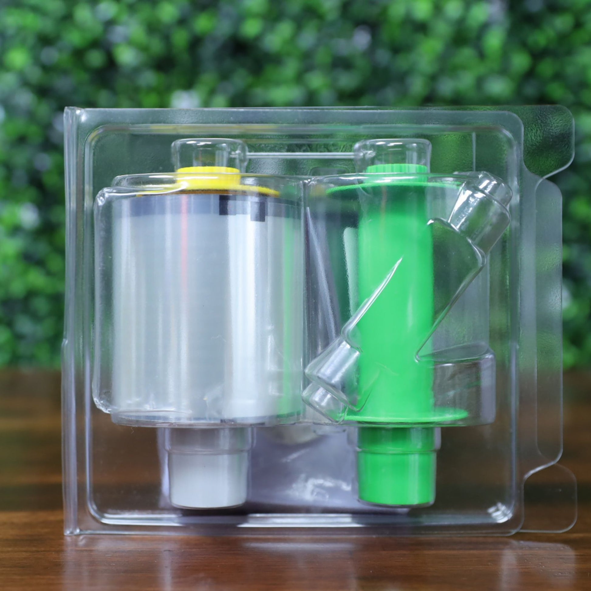 Back view of Fargo 84500 retransfer film in clear sealed packaging showing film roll, green take-up spool, and molded plastic holder. Photographed and sold by Specialist ID, an authorized HID Fargo dealer.