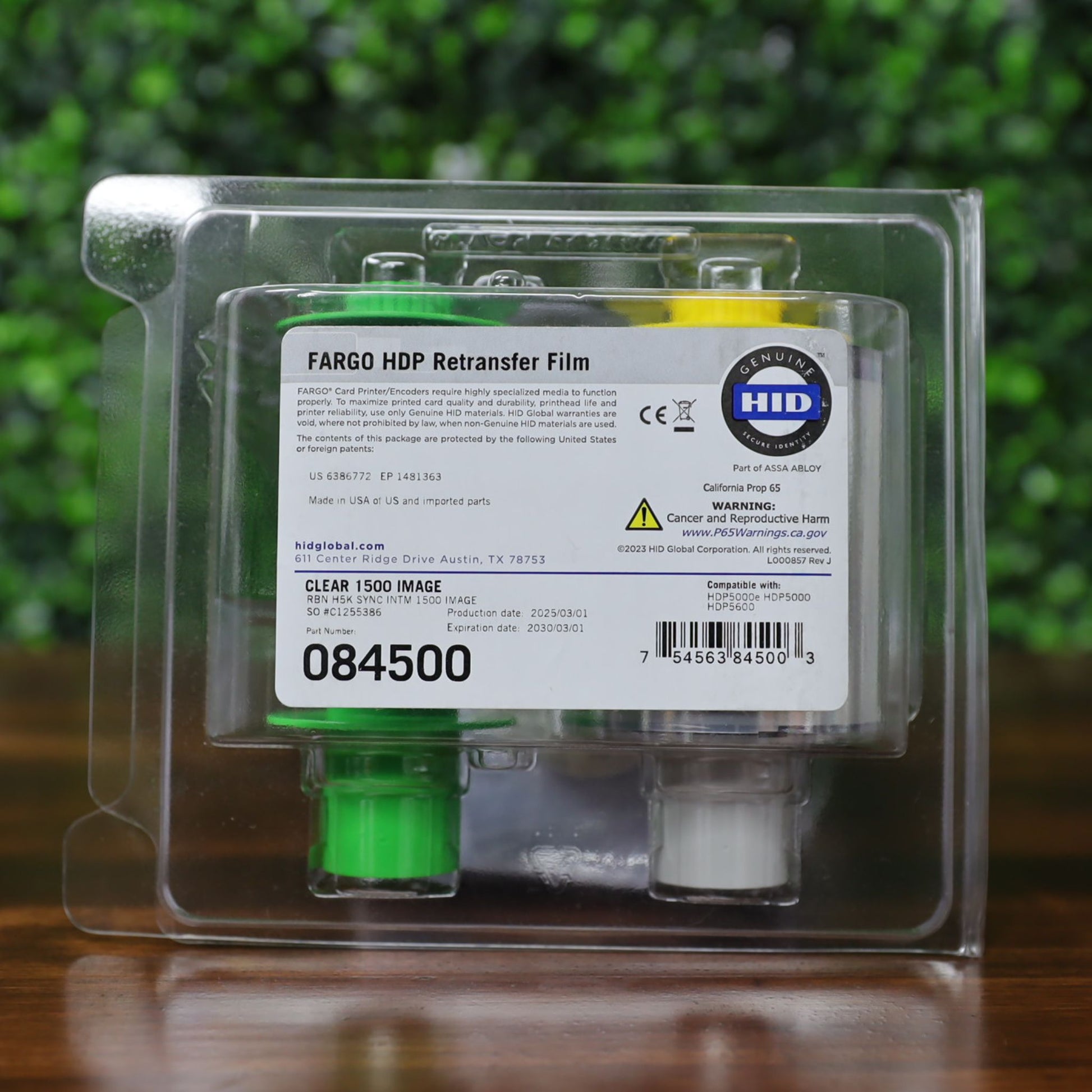 Fargo 84500 retransfer film in sealed retail clamshell packaging with visible part number, barcode, Genuine HID logo, and compatibility with HDP5000 and HDP5600 printers. Photographed and sold by Specialist ID, an authorized HID Fargo dealer.