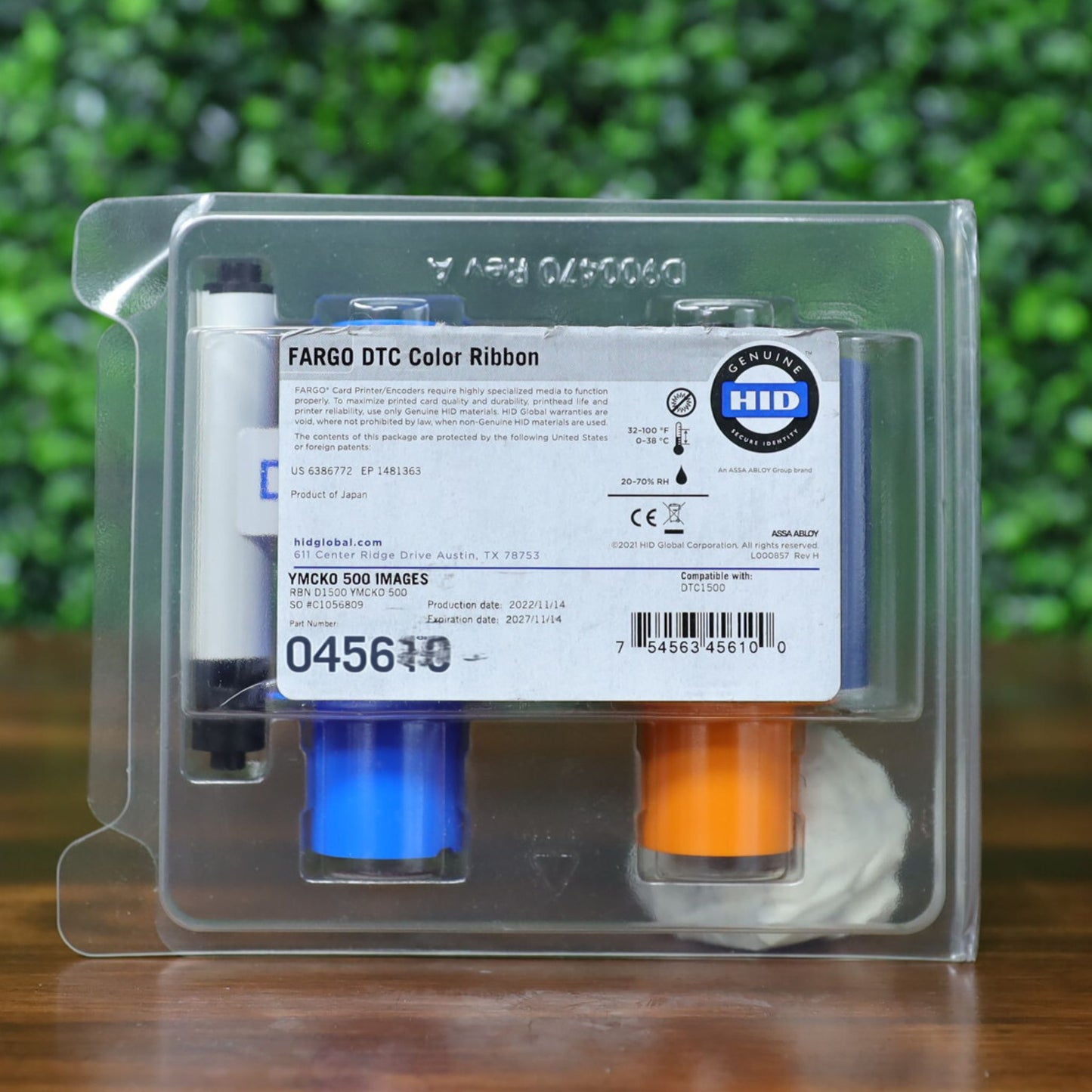 HID Fargo 045610 YMCKO Color Ribbon shown in clear retail packaging with visible label, barcode, and part number for 500-image yield. Compatible with DTC1500. Photographed and sold by Specialist ID, an authorized Fargo dealer.