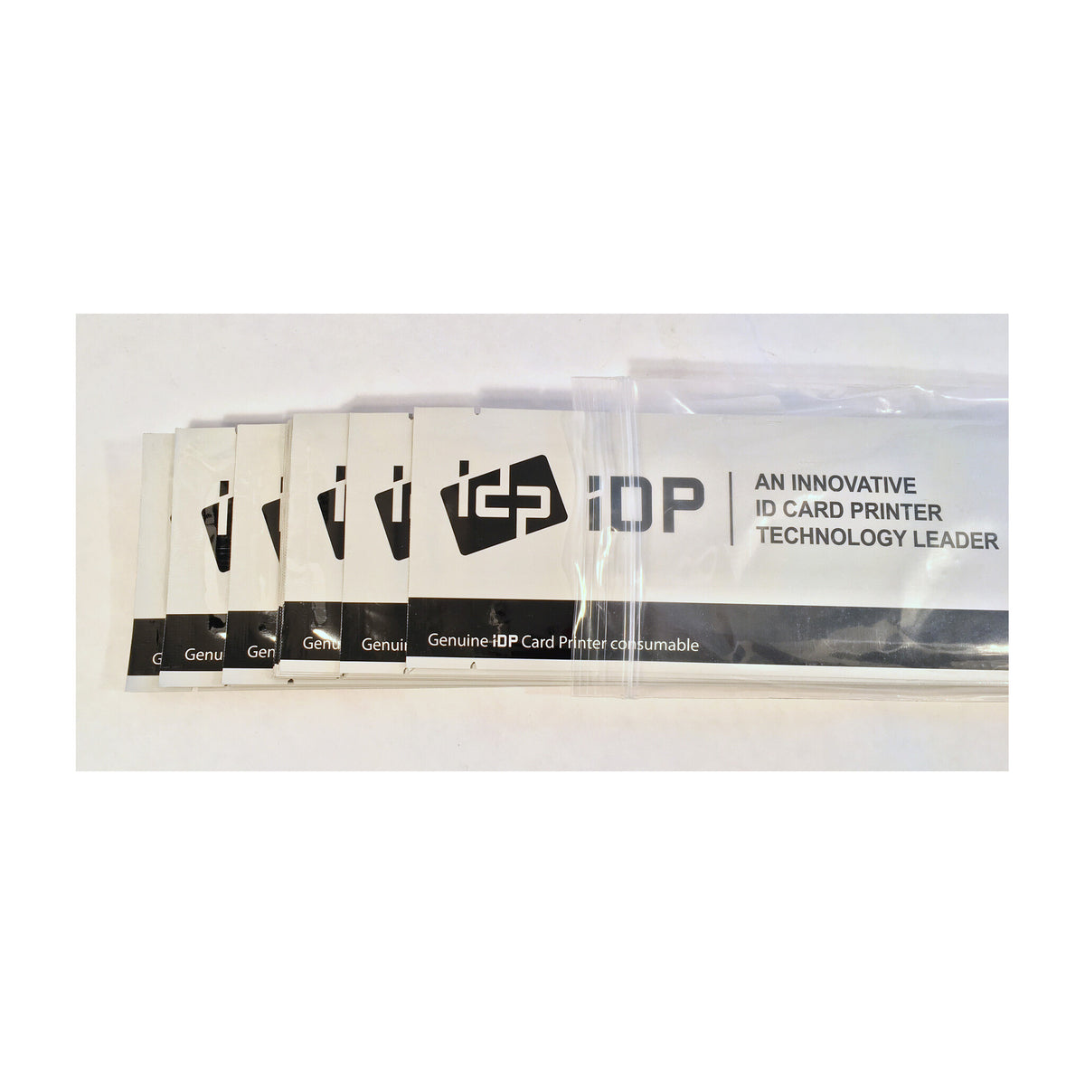 Ten IDP long cleaning cards in their sealed sleeves, fanned out to show the IDP branding
