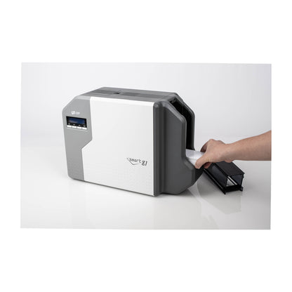 Hand sliding a stack of blank cards into the SMART-81DS input hopper on the right side of the printer
