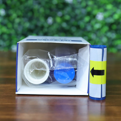 Magicard MA1000K-Blue ribbon cartridge and cleaning spool shown inside partially opened retail box with yellow directional label on wood surface and green foliage background. Photographed and sold by Specialist ID, an authorized Magicard dealer.