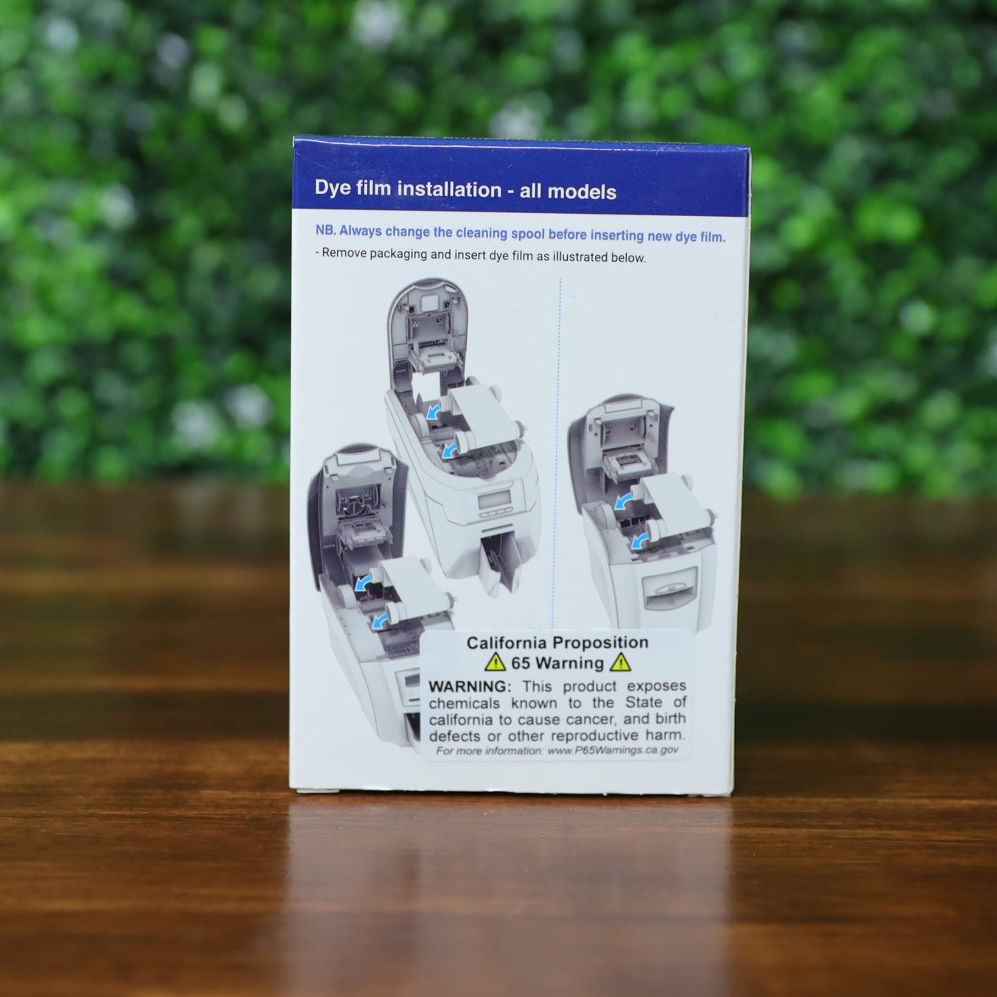The Magicard MA1000K GOLD Gold Ribbon – 1000 Prints box includes dye film installation instructions and a California Proposition 65 warning about chemicals that may cause cancer or reproductive harm. Photographed and sold by Specialist ID, an authorized Magicard dealer.
