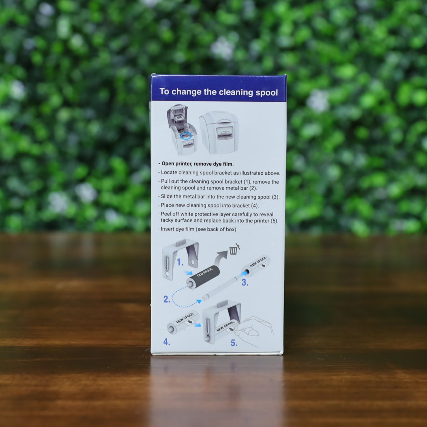 Side of Magicard MA1000K-RED ribbon box showing step-by-step cleaning spool replacement instructions with illustrations. Photographed and sold by Specialist ID, an authorized Magicard dealer.