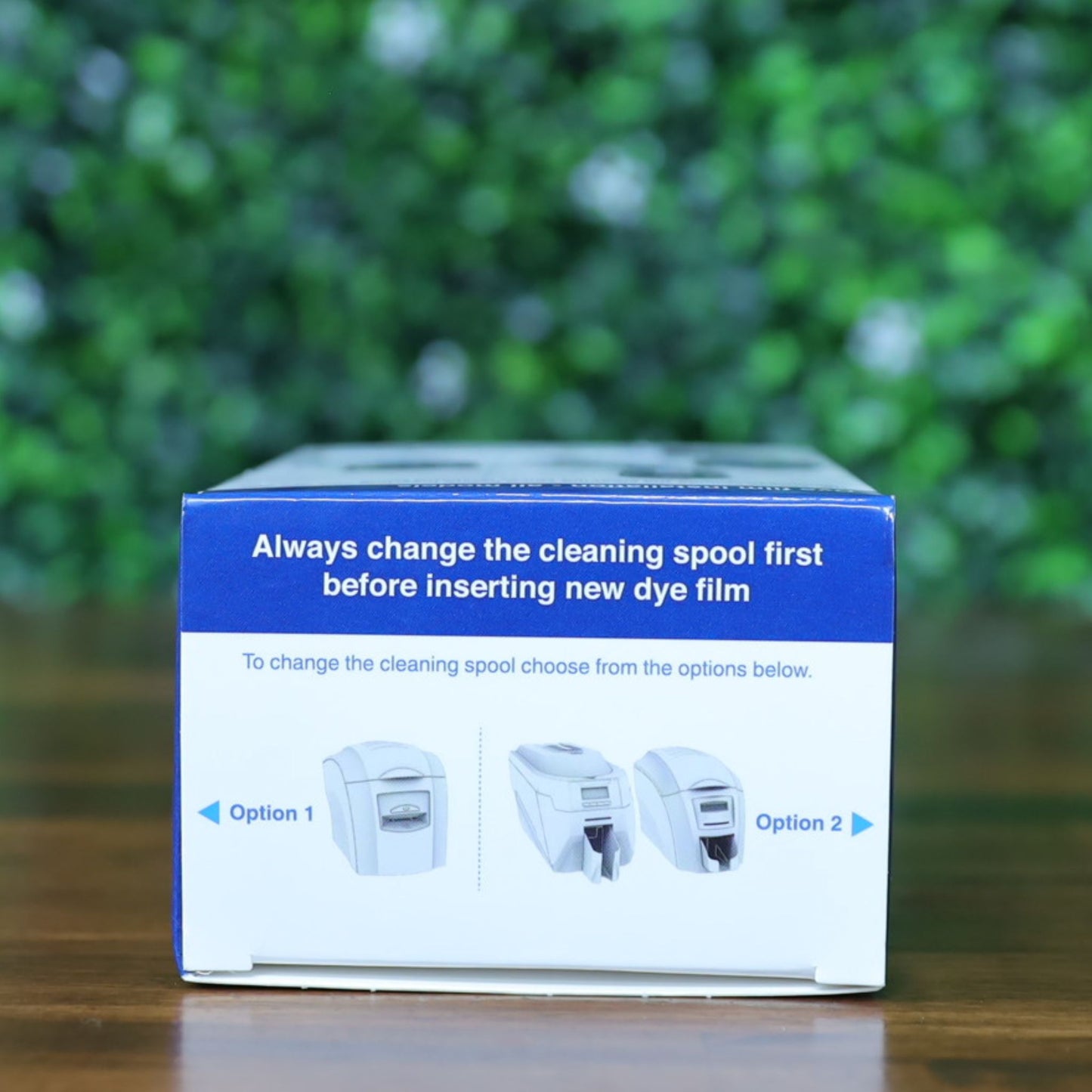 Top of the Magicard MA600KO printer ribbon box displaying cleaning spool replacement reminder and visual options for different printer models. Photographed and sold by Specialist ID, an authorized Magicard dealer.