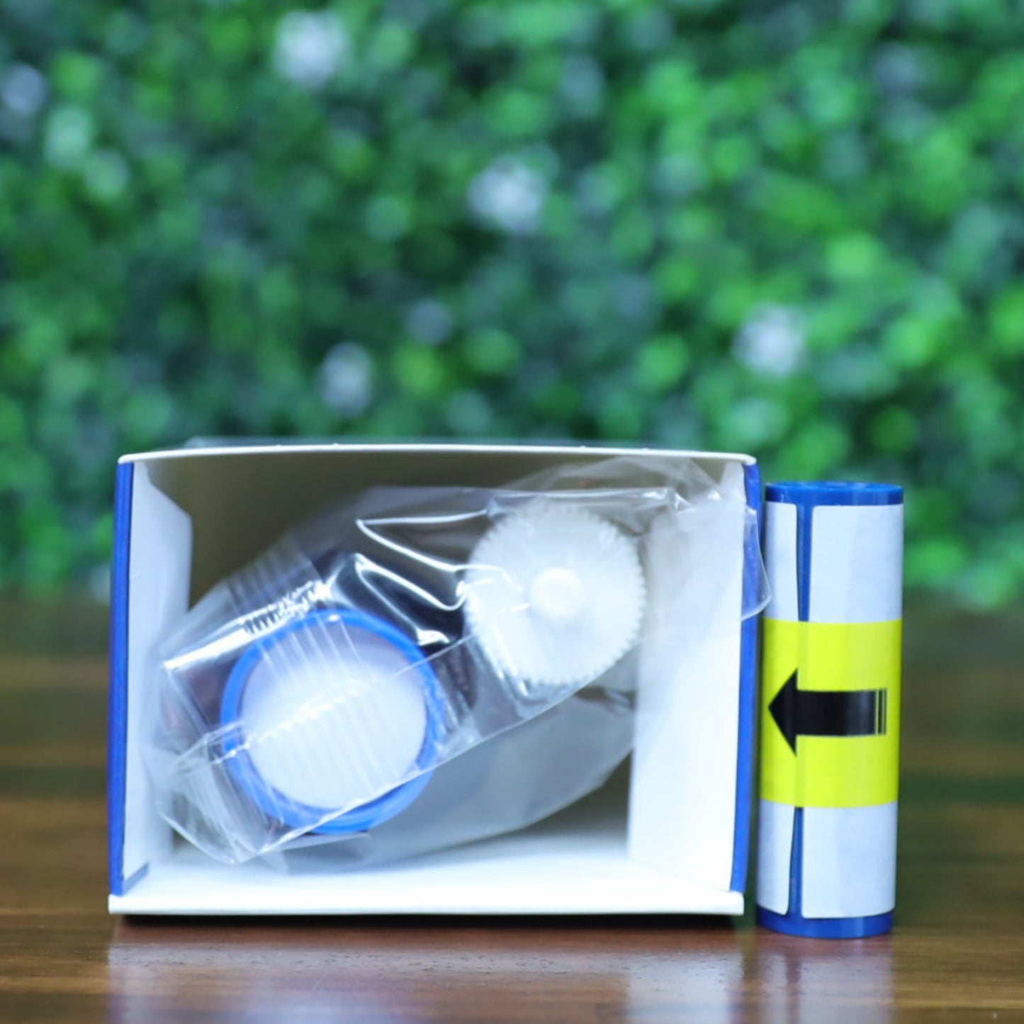 Top-down view of the Magicard MA600KO printer ribbon partially unpacked in its box, showing the ribbon spools and adhesive cleaning roller. Photographed and sold by Specialist ID, an authorized Magicard dealer.