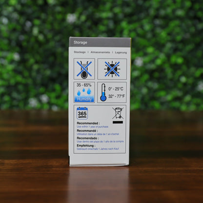 Storage guideline panel of Magicard MB200YMCKO/2 ribbon box showing recommended humidity, temperature range, and expiration icons in multiple languages. Photographed and sold by Specialist ID, an authorized Magicard dealer.