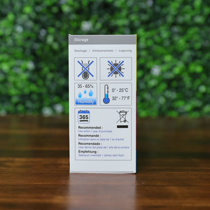 A storage instruction label for the Magicard MB250YMCKOK Color Ribbon (250 Prints), compatible with Magicard 600 printers, displaying humidity (35-65%), temperature (0-25°C/32-77°F), and one-year usage icons in multiple languages. Photographed and sold by Specialist ID, an authorized Magicard dealer.