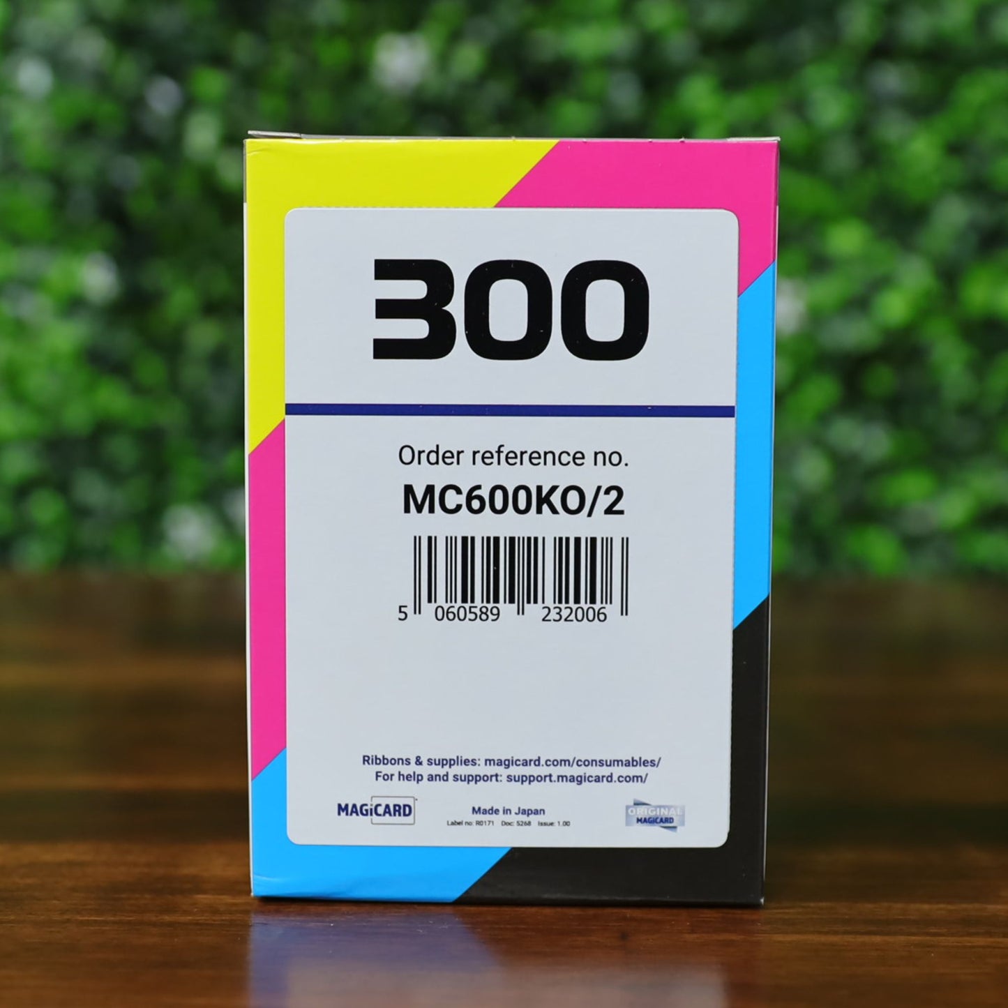 Front of the Magicard MC600KO/2 Black Monochrome Ribbon box, facing directly forward. Displays the order reference number, barcode, and full-color edge bands indicating CMYK printing compatibility. Designed for Magicard 300 and 600 Series ID card printers.
Photographed and sold by Specialist ID, an authorized Magicard dealer.