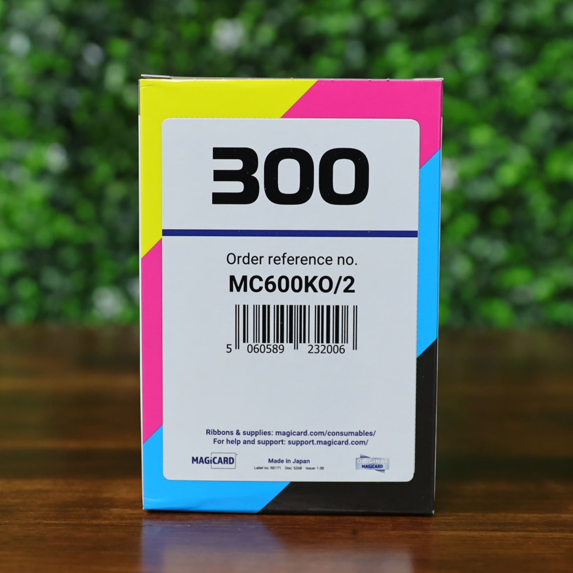 Front of the Magicard MC600KO/2 Black Monochrome Ribbon box, facing directly forward. Displays the order reference number, barcode, and full-color edge bands indicating CMYK printing compatibility. Designed for Magicard 300 and 600 Series ID card printers.
Photographed and sold by Specialist ID, an authorized Magicard dealer.