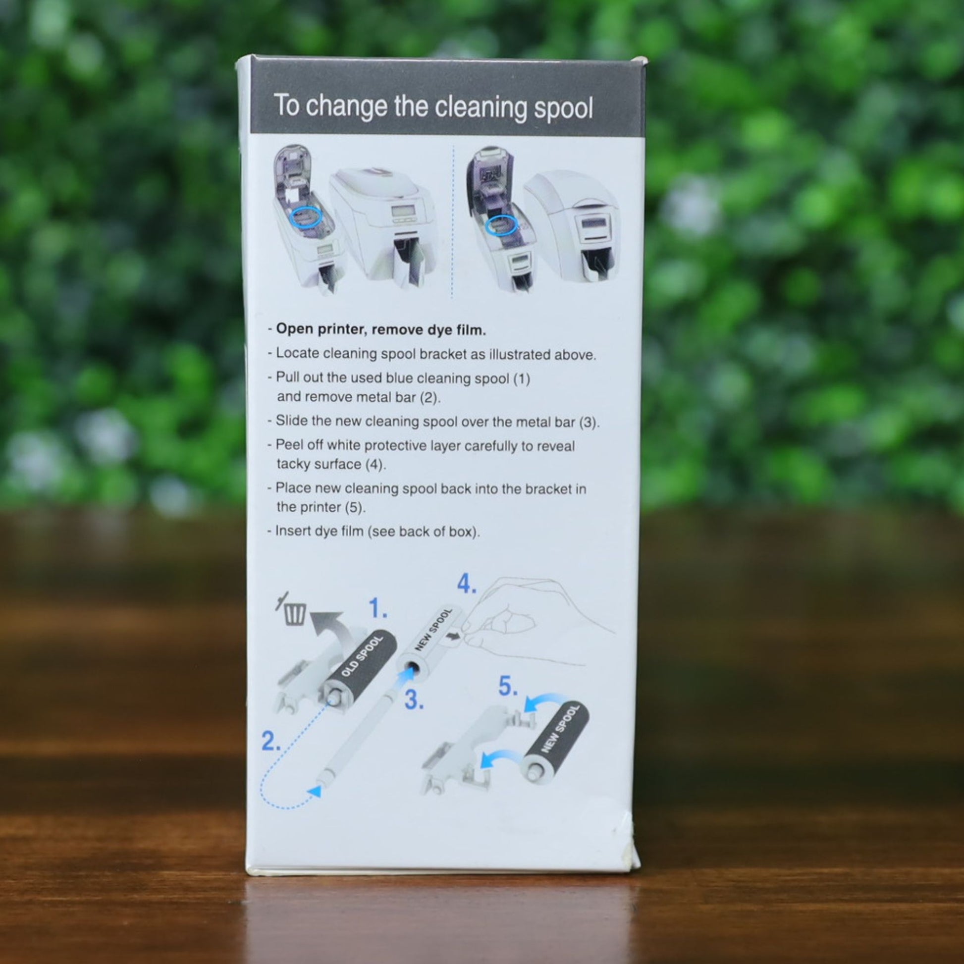 Side view of Magicard PR1000G dye film box showing detailed step-by-step cleaning spool replacement instructions with labeled illustrations and printer diagrams. Photographed and sold by Specialist ID, an authorized Magicard dealer.