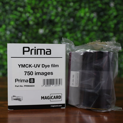 Close-up of Magicard Prima834 YMCK-UV ribbon and branded box, labeled for 750 prints and designed for Prima 8 printers. Genuine Magicard consumable in protective packaging. Photographed and sold by Specialist ID, an authorized Magicard Dealer.