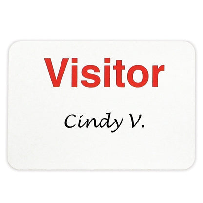 White rectangular adhesive badge with "Visitor" printed in large red letters, and "Cindy V." written below in black script, designed for effective visitor management, VISITOR Manual Non-expiring 2" X 3" Adhesive Badge, Box of 1000 (P/N 05806).