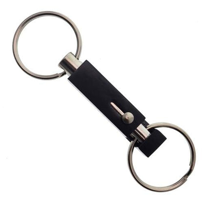 The Key-Bak #1101 Quick Release Pull-Apart Key Ring features a double keyring with a black plastic center section and a metal pin, making it easy to separate vehicle and house keys for better organization.