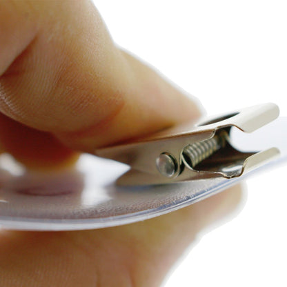 Close-up of a hand holding a 4x3 Inch Clear Vinyl Horizontal Badge Holder with Clip (1810-1300).