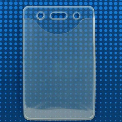 A PureClear Vertical Badge Holder (P/N 1815-1124), crafted from clear EVA material, with two circular holes and one elongated hole at the top, is set against a blue background with a pattern of lighter blue dots. Perfect for holding a credit card size photo ID card.