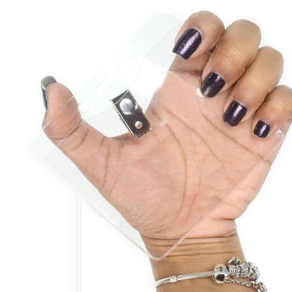 A hand with dark purple nail polish and silver bracelets holds a Clear Vinyl Horizontal Badge Holder With Clip And Chain Holes (P/N 1815-1405).