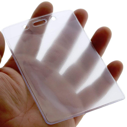 A hand holding a Heavy Duty 3 X 4 Name Badge Holder - 3x4 Vertical Textured Convention Conference Card Protector (P/N 1815-1450) designed to fit a 3"x 4" insert.
