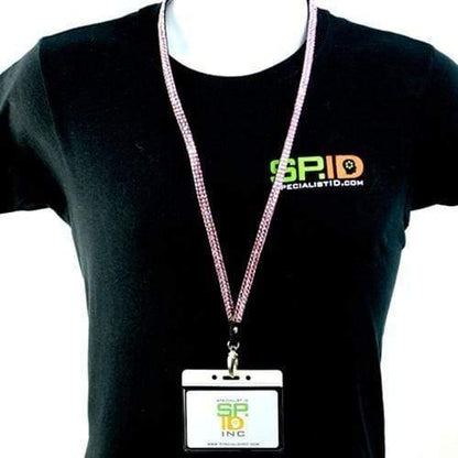 Person wearing a black t-shirt with "SPECIALISTID.COM" printed on it, along with a **Horizontal Vinyl Badge Holder with Color Bar Top - Great for Color Coding Access and ID (1820-100X)** on a lanyard around their neck displaying "SPID INC.