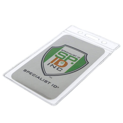 Description: This durable, Standard Vertical Vinyl ID Badge Holder (1820-1050) houses a credit card sized ID card featuring the logo and name "Specialist ID, Inc." in green and orange. The holder includes a slot for easy lanyard attachment.