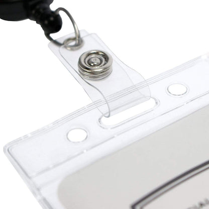 A close-up of a Standard Vertical Vinyl ID Badge Holder (1820-1050), designed for durability, attached to a retractable lanyard clip with a metal spring mechanism. Perfect for holding your credit card sized ID card securely.