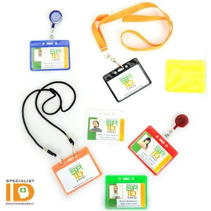 An assortment of Horizontal Vinyl Color-Back Badge Holder (P/N 1820-200X), lanyards, and badge reels in various colors and styles, branded with "Specialist ID," ensures quick identification for occasions like student bus assignments.