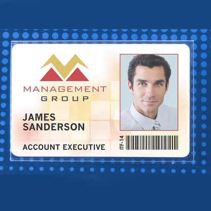 ID badge for James Sanderson, Account Executive at Management Group, featuring a photo, company logo, and barcode on a blue background. The Clear Rigid Vinyl 4X3 Name Tag Holder W/ Nickel Plated Steel Pin (P/N 1825-2400) measures 4" x 3" and includes a nickel-plated steel pin for secure attachment.