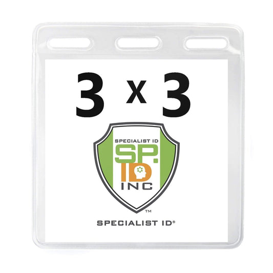 A 3 X 3 Clear Vinyl Horizontal Large Event Badge Holder (1840-1611) with three horizontal slots at the top. It contains a white card with "3 x 3" printed above a green and orange shield logo for Specialist ID, Inc. Perfect for attaching to an event lanyard.