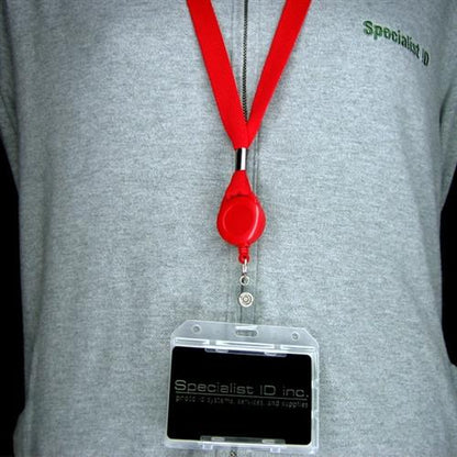 Person wearing a gray shirt with a "Specialist ID" logo, a red lanyard, and a rigid plastic 2-Sided Horizontal Multi-Card Holder (1840-305X) with a black "Specialist ID inc." card inside.
