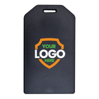 A black, rectangular Custom Rigid Plastic Luggage Tag Holders with 6" Clear Loop - Personalize with Your Logo with a notch at the top for attachment. The front features a shield graphic with the words "YOUR LOGO HERE" in the center—perfect for custom luggage tags to boost brand awareness through promotional giveaways.