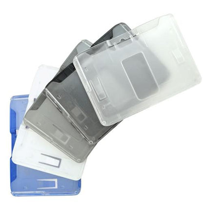 A set of transparent, stackable **B-Holder Rigid Plastic Horizontal Holder (P/N 1840-665X)** in various colors including blue, white, and shades of gray, arranged in a fanned-out pattern. Perfect for use as an ID badge holder or for credit card sized IDs.