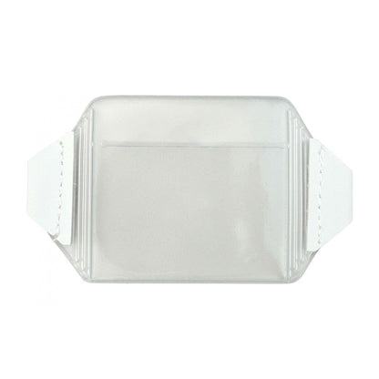 A clear, rectangular plastic sleeve with two white flaps on each side, perfect for use as a Vinyl Horizontal Arm Band Badge Holder With Elastic Strap (P/N 1840-7000). Sold by Specialist ID.