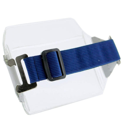 A Clear Over Size Vinyl Horizontal Arm Band Badge Holder (P/N 1840-7100) is displayed on a transparent stand, reminiscent of an armband badge holder. Sold by Specialist ID.