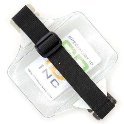 A clear Oversize Vertical Armband Badge Holder (1840-7110) made from heavy-duty vinyl, featuring a black adjustable strap and displaying a Specialist ID card inside.