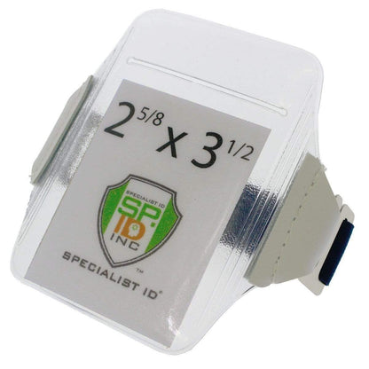 A clear Oversize Vertical Armband Badge Holder (1840-7110) with a white wrist strap features a Specialist ID logo and displays the dimensions 2 5/8 x 3 1/2 inches.