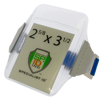 A transparent, heavy-duty vinyl ID badge holder with an adjustable strap, featuring a 2 5/8 x 3 1/2 inch sizing label and the Specialist ID Inc logo on the front is replaced by an Oversize Vertical Armband Badge Holder (1840-7110).