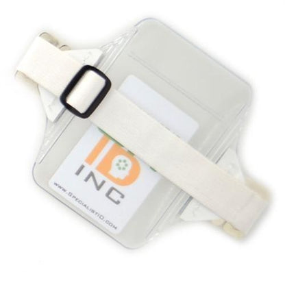 A heavy-duty Oversize Vertical Armband Badge Holder (1840-7110) with a clear plastic arm strap, featuring an adjustable white band and an IDP Inc. logo card inside, perfect for those needing an oversize vertical armband solution.