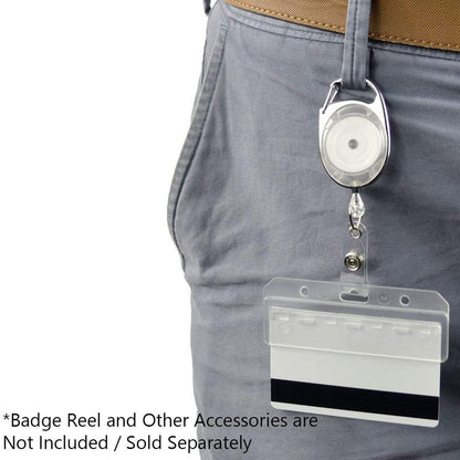 Close-up of a retractable badge holder with a blank card attached to a belt clip on a person's pants. The text indicates that Swiple Card Holder - Rigid Horizontal Half Card Badge Holder - Leaves Mag Stripe Exposed for Easy Swiping (1840-8000) and other accessories, such as access control cards, are not included.