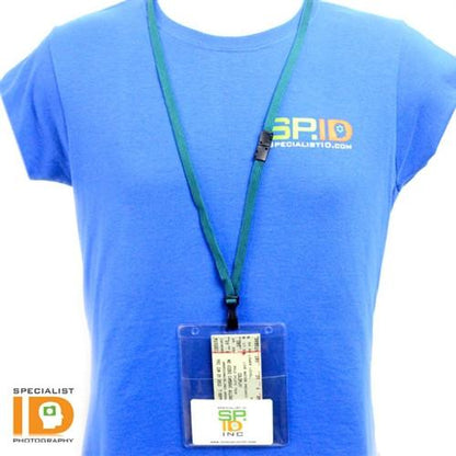 Person wearing a blue Specialist ID t-shirt with an ID badge holder hanging from a green lanyard around their neck. The Two Pocket Event Badge Holder with 4x5 and 4x3 Sleeves - Clear Vertical Credential Holder (1860-4000) contains an ID card and a smaller card, showcasing its clear front and back for easy visibility.