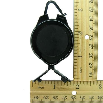 A Ski Pass and Sports Retractable Reel (P/N 2120-4001) with a hook at the top and a clip at the bottom, featuring a rugged plastic design, is placed alongside two rulers, showing a height of approximately 2.75 inches.