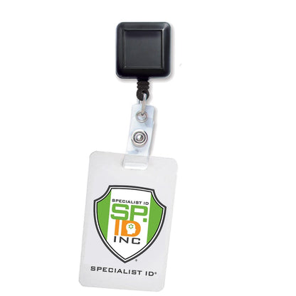 Black Square Badge Reel With Spring Clip (P/N 2120-5701) with a black clip and a white ID badge. The badge features the logo and text "Specialist ID, SP Inc" with a green, orange, and black design. Comes with a durable retractable nylon cord for everyday use.