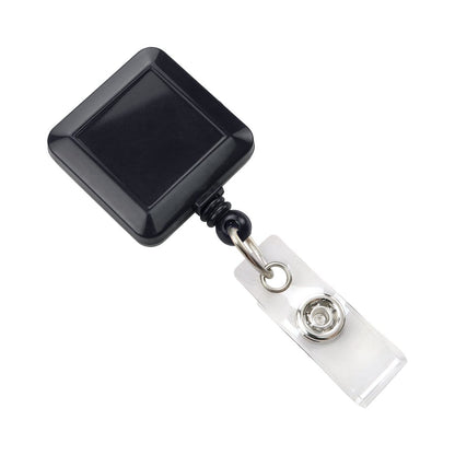A Black Square Badge Reel With Spring Clip (P/N 2120-5701) with a metal spring clip and a clear plastic strap attachment is shown, featuring a retractable nylon cord for ease of use.