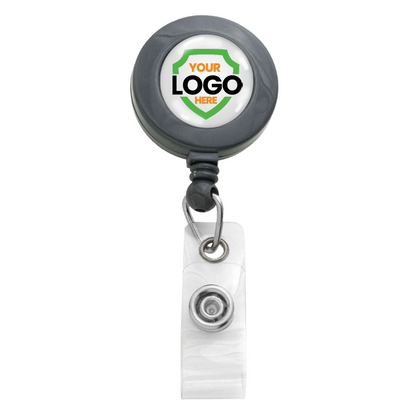 A round retractable badge holder with a customizable logo space at the center and a clear clip attachment at the bottom, perfect for promotional giveaways. These Custom Badge Reels with Swivel Spring Clip - Personalized Bulk ID Badge Holders for Business, Nurses, and Teachers are an excellent tool for increasing brand awareness.