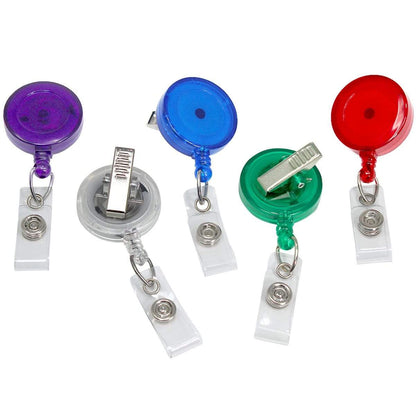 Five Translucent Badge Reels with Swivel Clip (P/N 2120-762X) in purple, blue, red, green, and clear, each with a sturdy metal swivel clip and a clear strap for holding ID cards. These Translucent Badge Reels with Swivel Clip (P/N 2120-762X) add a pop of color while keeping your cards secure and easily accessible.